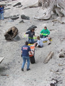 EMS personnel attend to volunteers during the mass casualty drill on Petroglyph Beach. Hillman/KSTK
