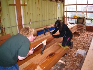 Susie Kasinger (left) and Linda Churchill (right) finish work on the final beams.