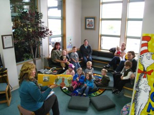 The kids listen as Sarah Merritt reads a story to them during the library's "Storytime".