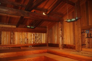 The interior of the newly rebuilt Chief Shakes Tribal House with two of the re-painted lanterns that were carved in the 1940s. Photo by Renee Claggett.