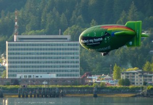 A Greenpeace airship promoting the group's Bering Sea Canyons protection initiative sails over Juneau's Gastineau Channel Saturday evening. Photo by Ed Schoenfeld, CoastAlaska News.