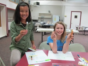 The girls test water samples at the Alaska Crossings workshop - Photo courtesy of Diane O'Brien