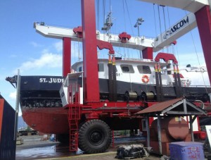 Wrangell's new Ascom boat lift hauls the 98-foot fish-packer St. Jude out of the water Saturday, May 24. (Delton Claggett /KSTK)
