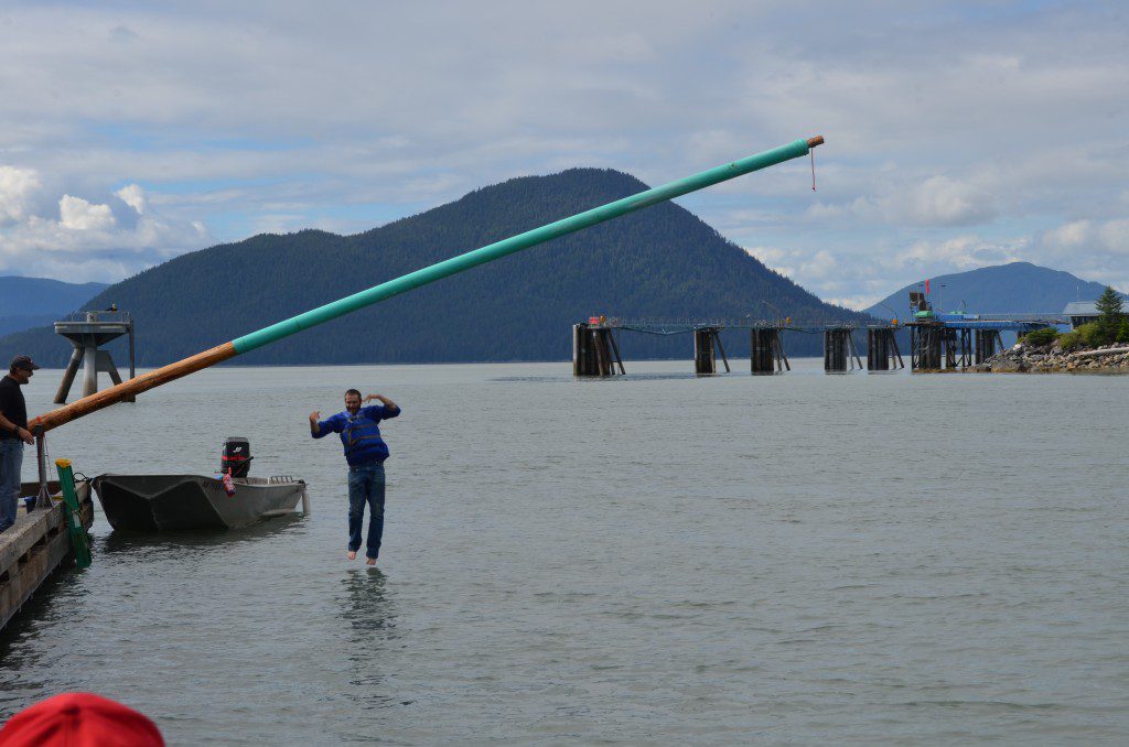Several competitors hit the water during the greased pole contest Thursday, July 3, 2014.
