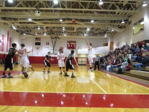 Dawson Miller goes long for a three-point basket. (Aaron Bolton, KSTK News)