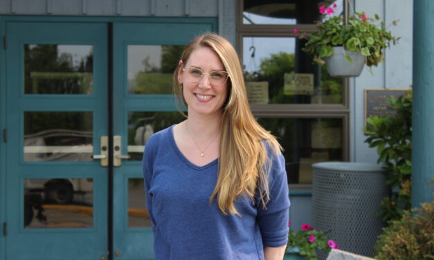 Sarah Scambler turns the page as new library director