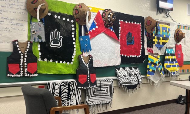 Evergreen Elementary students present their wearable art to school board