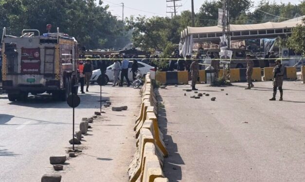 A suicide bomber targets an Islamabad court, killing 12 people and wounding 27