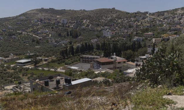 Israeli settlers force Palestinian family to exhume and rebury their father